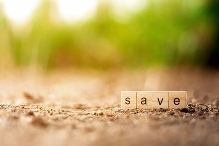 "SAVE" alphabet on the arid ground.の写真素材