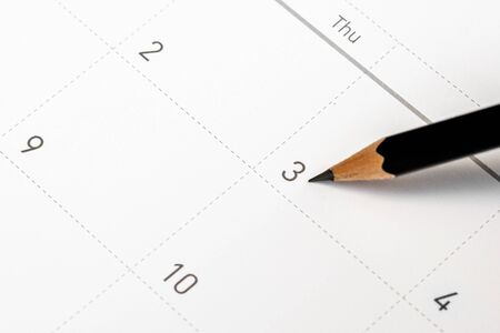 The pencil points to the 3rd in the calendar.の写真素材