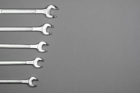 Set of spanner on grey desk background. - industrial workshop hand tools concept.の写真素材