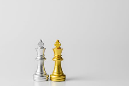 golden and silver king chess standing encounter.の写真素材