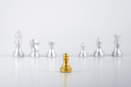 golden pawn chess standing encounter enemies. - leadership concept.の写真素材