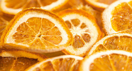 Dried orange slices orange blurred background, selective focus, space for text.の写真素材