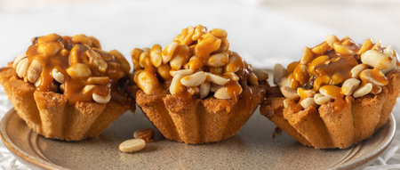 Peanut tart covered with salted caramel sauce. High quality photoの写真素材