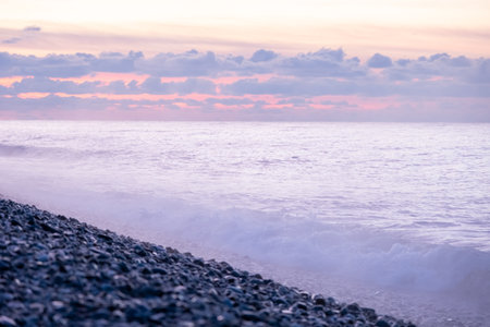 Purple very peri sky and sea sunset in Batumi Georgia, fog over sea after storm, blurred selective focus background. High quality photoの写真素材
