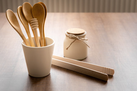 Tableware from natural materials, bamboo wooden spoons in cup, zero waste eco friendly concept, free space for textの写真素材