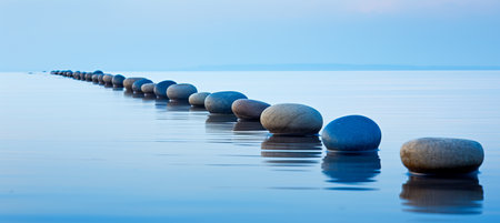 Tranquil zen concept serene blue step stones in calm water for mindful meditation and relaxationの素材