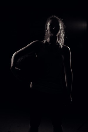 Young woman stands with the ball.の写真素材