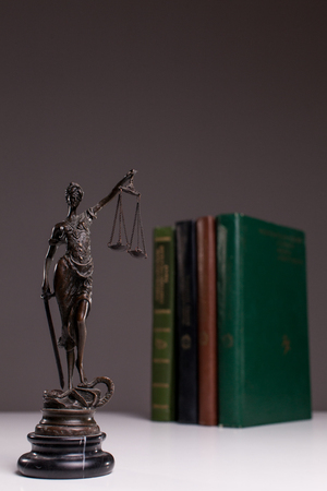 Themis on the background of the books.の写真素材