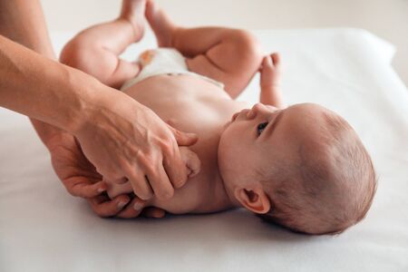 a young mother holding a child by the handの写真素材