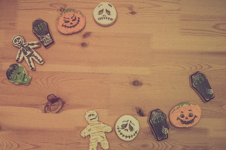Cookies of different kinds for Halloween on a wooden table. Preparing for Halloween.の写真素材