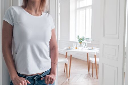 Close-up of a girl in a white t-shirt. Mock-up for logo or design on clothesの写真素材