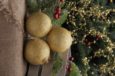 christmas toys on the background of a green Christmas tree with flashlightsの写真素材