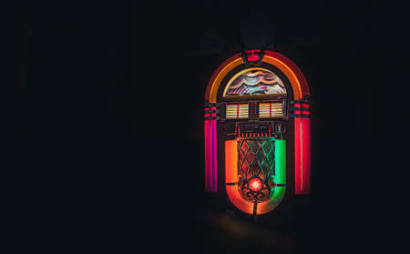 Retro jukebox on black background