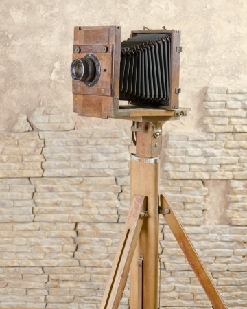 an old studio camera with tripodの写真素材