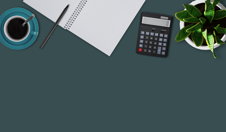 Top view of flat lay picture with blank notebook, pen, cup of coffee or tea, calculator and flower. Office desktop of accountant. Modern office desk table with necessary supplies. Business conceptの写真素材