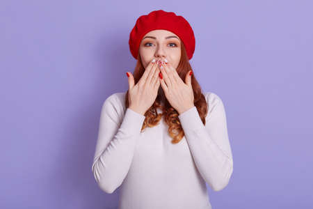 Attractive gorgeous woman blows sweet kiss at camera, flirts with somebody, says goodbye. Adorable...