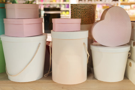 Gift cardboard boxes for gifts packaging are displayed on the stand in the storeの写真素材