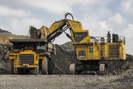 Excavator and truck in the iron quarry in Ukraineのeditorial素材