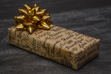 A small gift box on a dark tableの写真素材