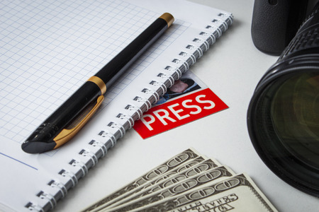 A few bills on the desk of a journalistの写真素材