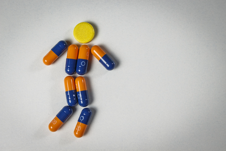 Medicines laid out in the form of a running manの写真素材