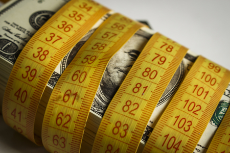 Many dollar bills tied with meterの写真素材