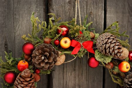 Christmas wreath with pine cones and nutsの写真素材