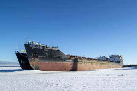 Cargo vessels at the port in the winter parkingの写真素材