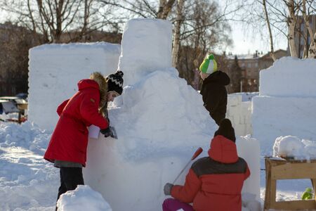 Petrozavodsk, Russia - 13 february 2019. People create snow sculptures