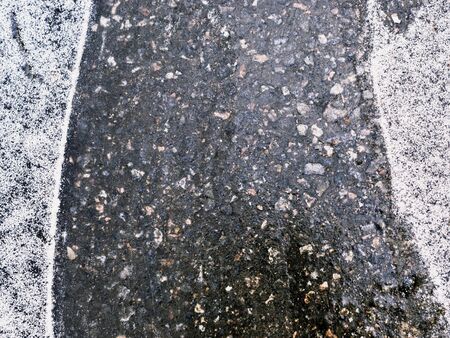ice-crusted ground covered by snow. dangerous. backgroundの写真素材