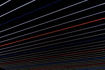 abstract background of lines. White, blue and red lines on black background