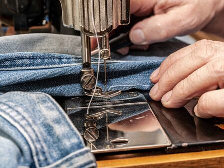 close up of sewing machine and item of clothing