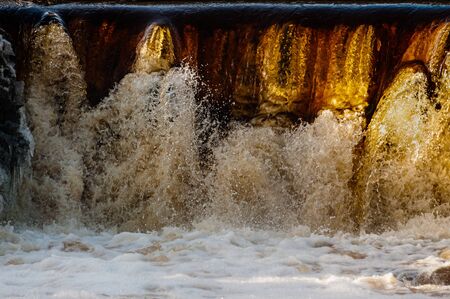 Background with small waterfall. frozen movement of water splashesの写真素材