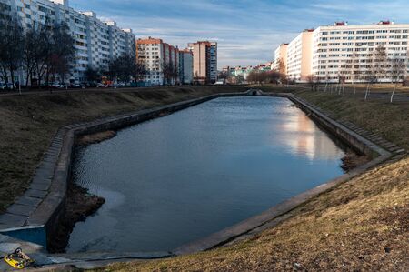 cityscape with panel houses and body of waterの写真素材