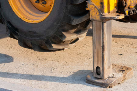 close-up of the hydraulic support of the excavator. details of equipment for road worksの写真素材
