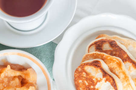 delicious breakfast with pancakes. Top view on a plate with pancakes and socket with jam