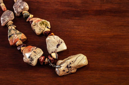 necklace made of Ural Jasper on wooden backgroundの写真素材