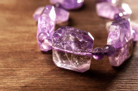 close up of necklace with amethyst on wooden backgroundの写真素材