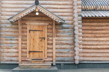 wooden door to traditional wooden Orthodox church. Door to log houseの写真素材
