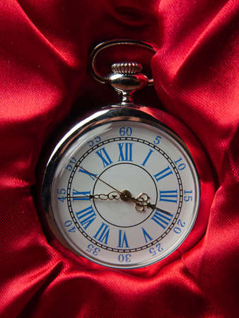 Retro style watch with red fabric backingの写真素材