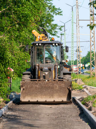 Petrozavodsk, Russia - 8 Juny 2020. road loader on the pavement in preparation for laying new...