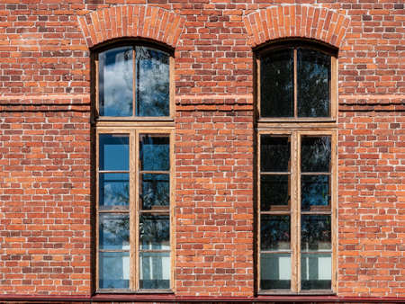 Beautiful high Windows in an old brick building. architectural detail