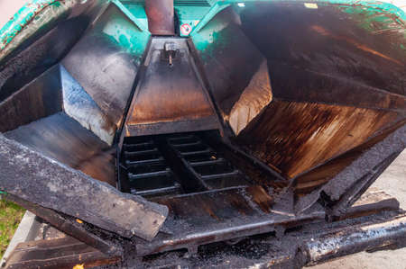 close up of frontside empty asphalt paving machine