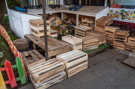 lots of empty wooden boxes on the street vegetable storeのeditorial素材
