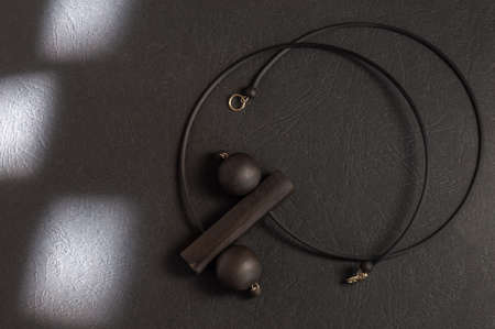 black jet necklace on black background with light spots. High quality photoの写真素材