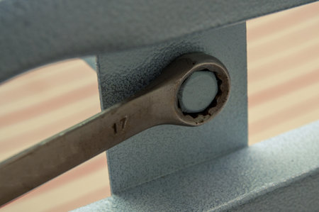 tightens the bolt with a wrenchの写真素材