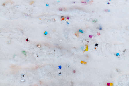 abstract background on the theme of the holiday with confetti on the snow. High quality photoの写真素材