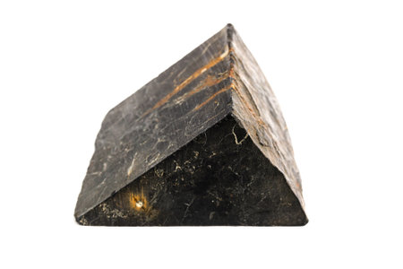 shungite stone with pyrite streaks isolated on white background. High quality photo