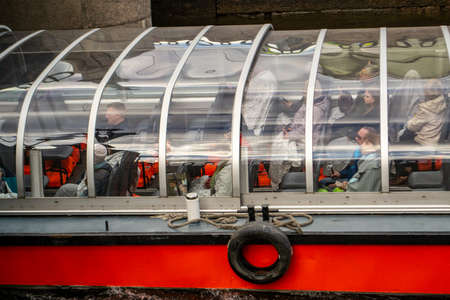 Saint Petersburg, Russia - 4 May 2019. tourist pleasure boat sails under the bridgeのeditorial素材