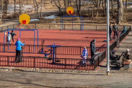 people of different ages on the outdoor sports ground